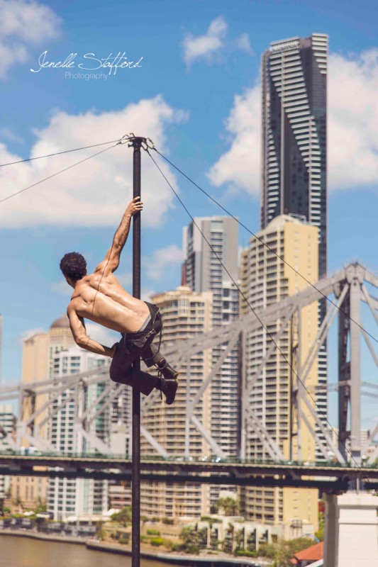 Internationally acclaimed circus artist, Felix Pouliot, on Chinese pole in Brisbane, Queensland.
